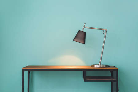 Glowing lamp on table in roomの写真素材