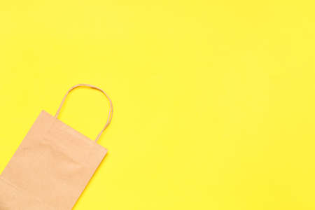 Paper shopping bag on color backgroundの写真素材