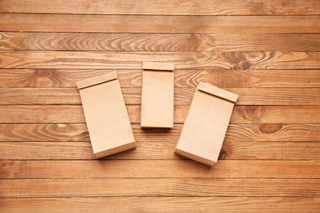 Paper bags on wooden backgroundの写真素材