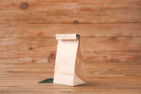 Paper bag on wooden backgroundの写真素材