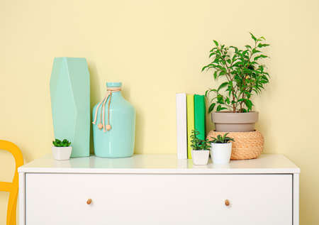 Chest of drawers with decor near color wallの写真素材