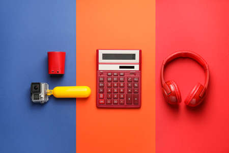 Different modern devices on color background