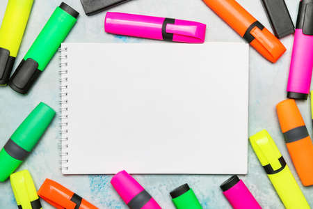 Set of markers and notebook on color backgroundの写真素材