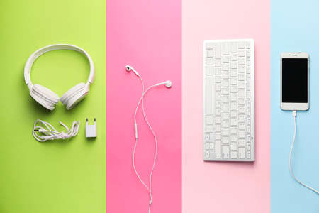 Different modern devices on color backgroundの写真素材