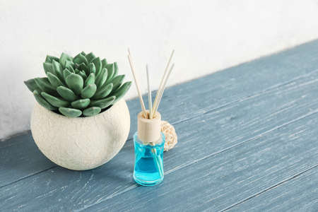 Herbal reed diffuser on wooden table