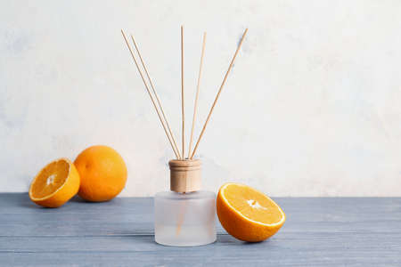 Citrus reed diffuser on wooden tableの写真素材