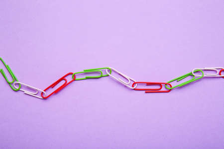 Paper clips on color background. Unity conceptの写真素材