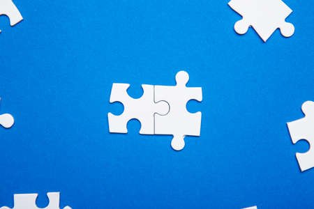 Pieces of jigsaw puzzle on color background. Unity concept