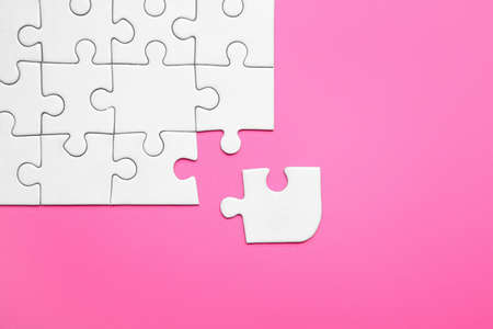 Jigsaw puzzle pieces on color background. Unity conceptの写真素材