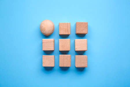 Wooden cubes and sphere on color background. Unity conceptの写真素材