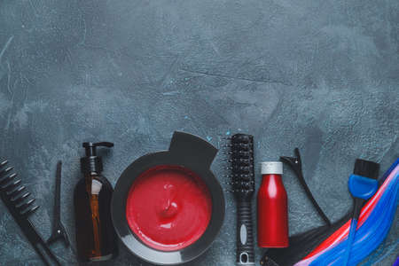 Supplies for hair coloring on dark background