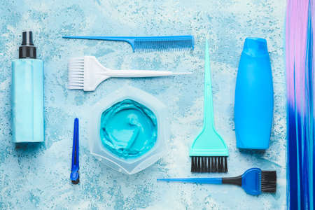 Supplies for hair coloring on color backgroundの写真素材