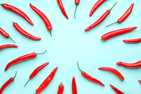 Hot chili pepper on color backgroundの写真素材