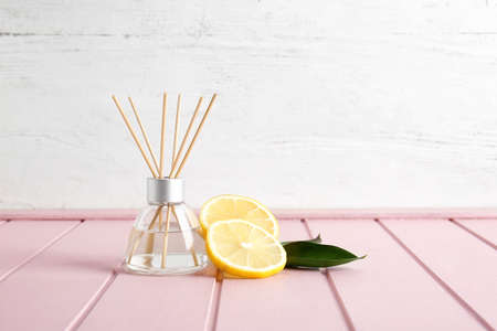 Citrus reed diffuser on table in roomの写真素材