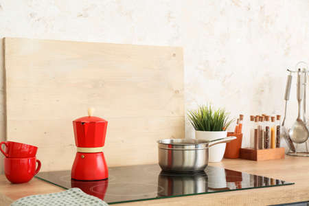 Stove and set of utensils on kitchen counterの写真素材