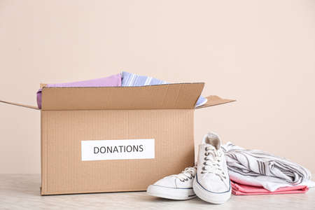 Box with donations on table
