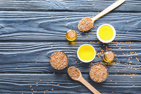 Composition with flax oil on wooden tableの写真素材