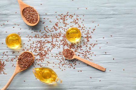 Composition with flax oil on wooden table