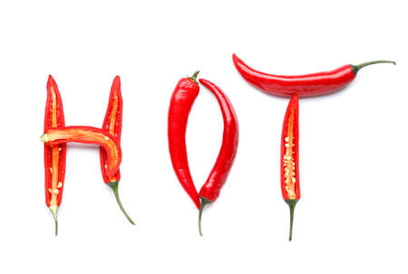 Word HOT made of chili pepper on white backgroundの写真素材