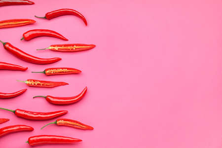Hot chili pepper on color backgroundの写真素材