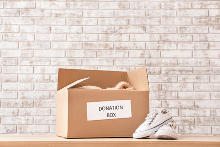 Box with donations on tableの写真素材