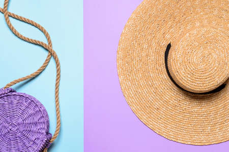 Straw hat and bag on color backgroundの写真素材