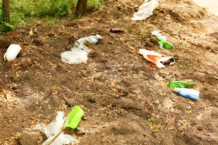 View of garbage in park. Concept of soil pollution