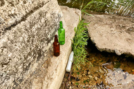 View of garbage near river outdoors. Concept of soil pollutionの写真素材