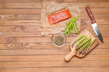 Asparagus with salmon and spices on tableの写真素材