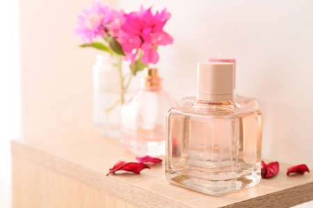 Bottles of floral perfume on tableの写真素材