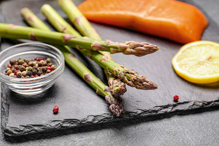 Asparagus with spices on dark backgroundの写真素材