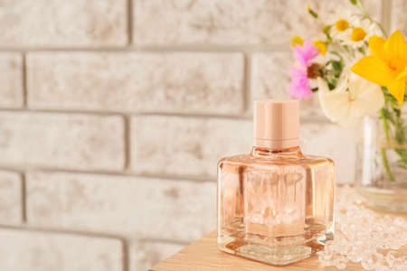 Bottle of floral perfume on table