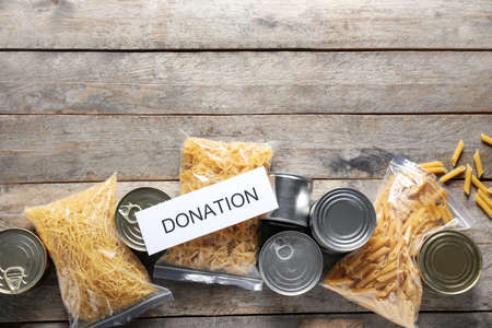 Different products on wooden background. Donation conceptの写真素材
