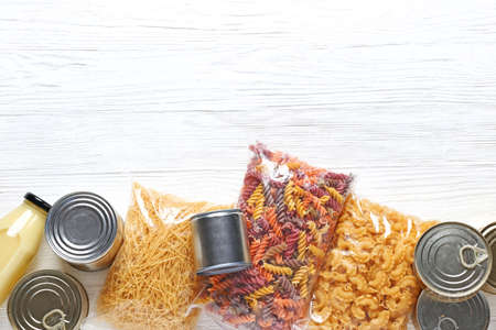 Different products on wooden background. Donation concept