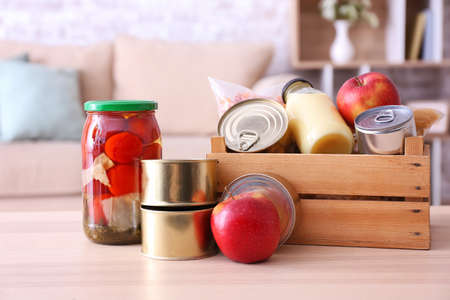 Donation box with products on tableの写真素材