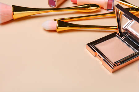 Makeup cosmetics and brushes on color backgroundの写真素材