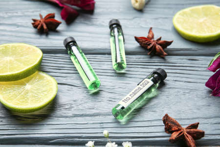 Perfume samples on wooden background