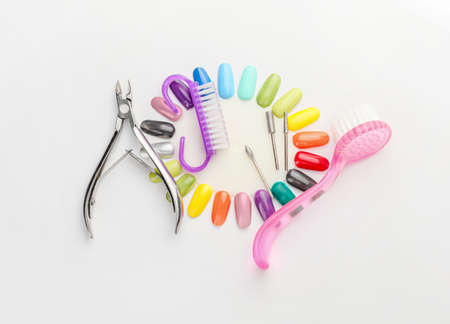 Supplies for manicure on white background