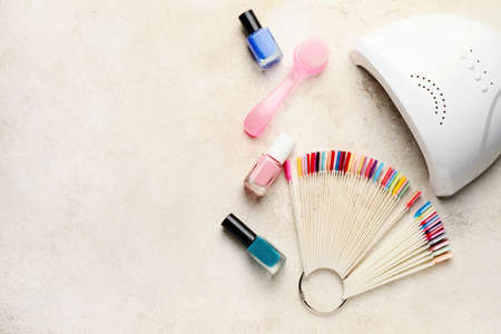 Supplies for manicure on light background