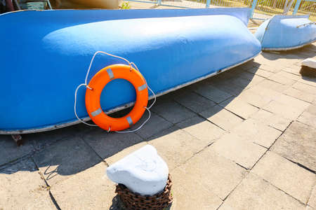 Boat with lifebuoy ring on berthの写真素材