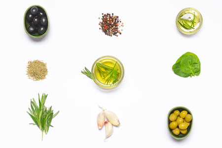 Rosemary oil and spices on white background