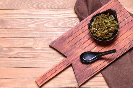 Composition with tasty seaweed on wooden backgroundの写真素材