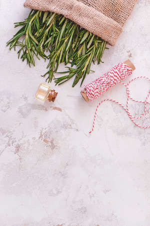 Bottle of rosemary essential oil on light backgroundの写真素材