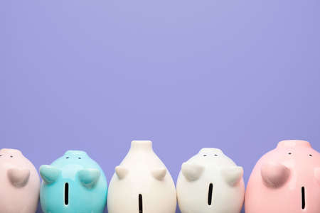 Piggy banks on color backgroundの写真素材