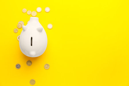 Piggy bank and money on color backgroundの写真素材