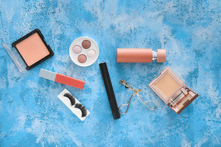 Set of decorative cosmetics on color backgroundの写真素材