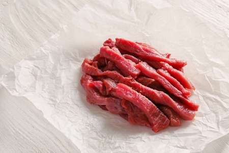 Pieces of fresh beef meat on tableの写真素材