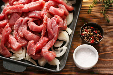 Ingredients for beef stroganoff on table