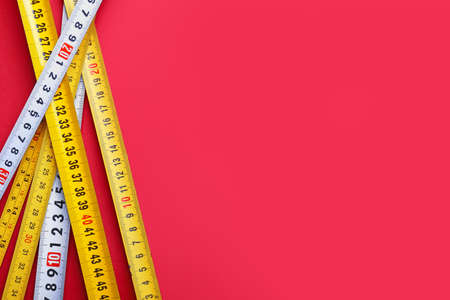 Measuring tapes on color backgroundの写真素材