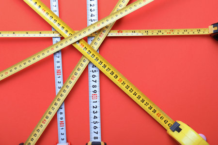 Measuring tapes on color background